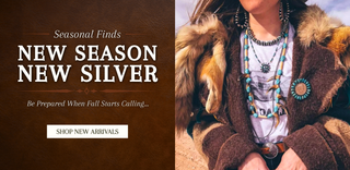A promotional banner for 'New Season New Silver' featuring a model on the right wearing a brown fur-trimmed coat, layered silver necklaces, and turquoise jewelry, alongside a brown textured background with white text on the left.